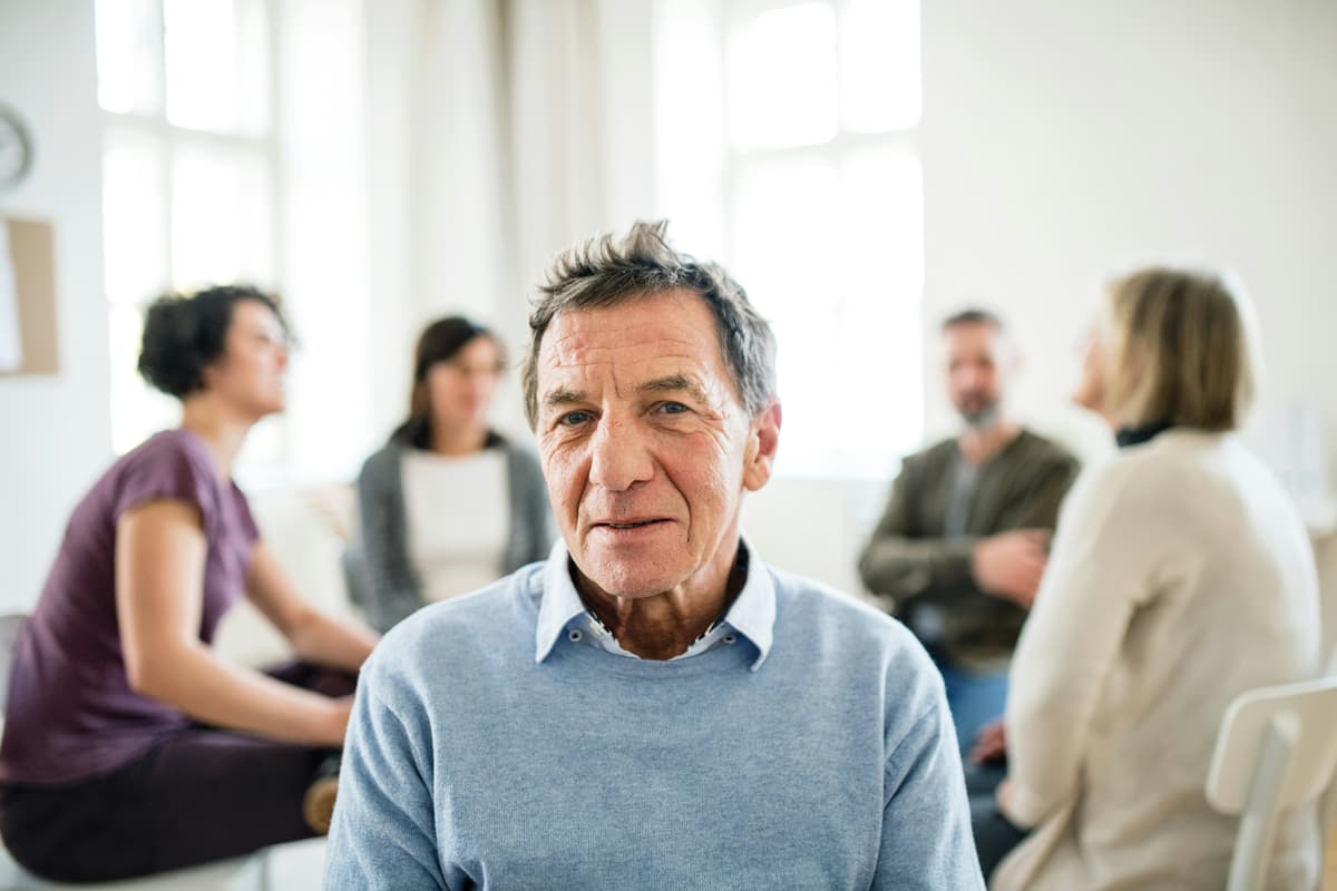People in a group therapy session during aftercare